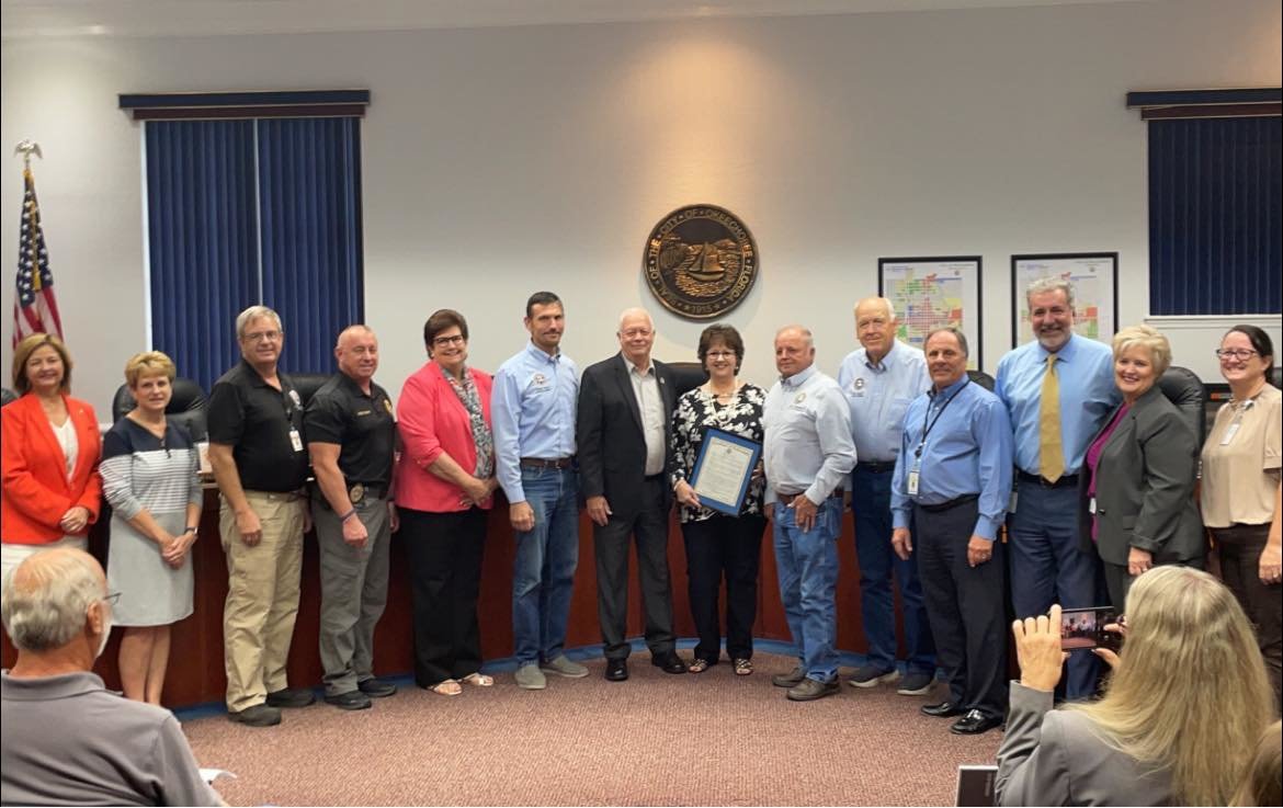Executive Assistant Robin Brock (center) was honored at the Oct. 18 city council meeting. She will soon be retiring after 22 years with the city.